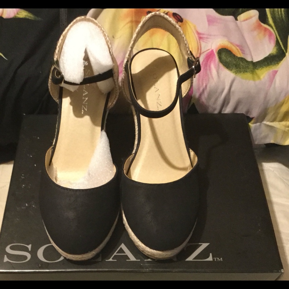 Black espadrille wedges.